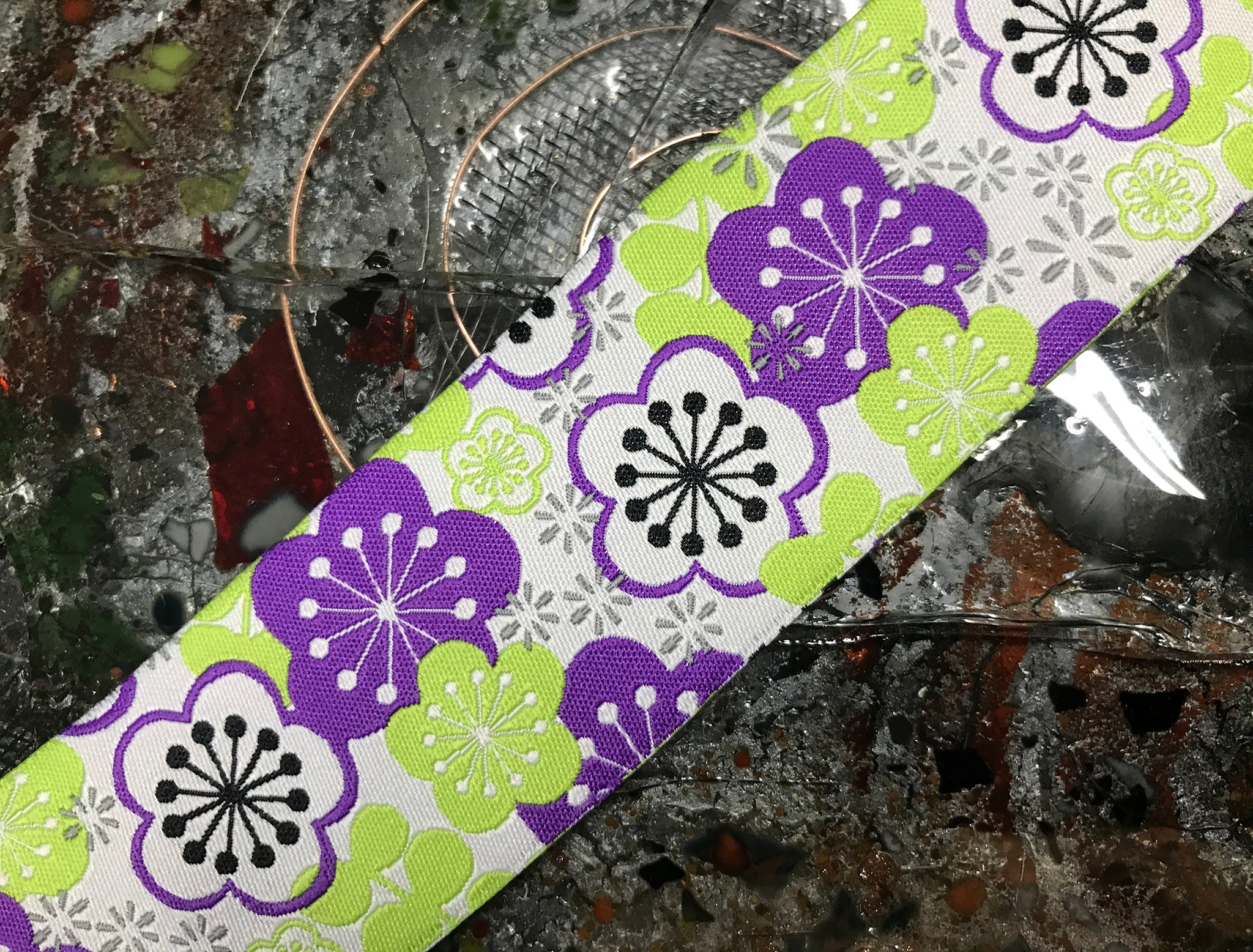 Purple/White/Black Floral on Green Background - Embroidered Jacquard Ribbon - 1.5" Wide.