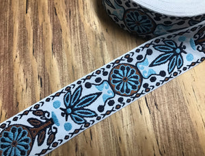 Shades of Sky Blue/Black/Brown on Natural White  Background - Jacquard Ribbon - 5 cm Wide.