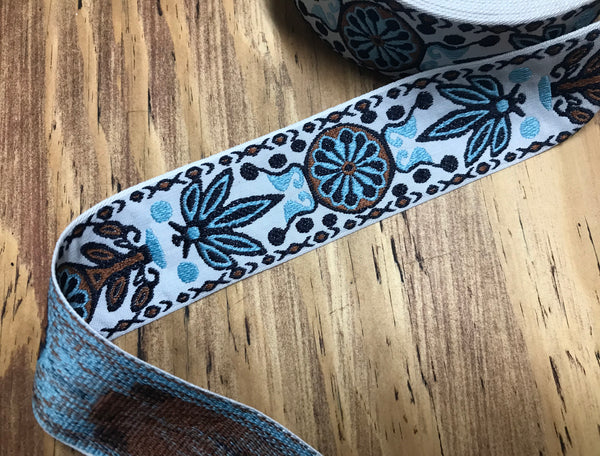 Shades of Sky Blue/Black/Brown on Natural White  Background - Jacquard Ribbon - 5 cm Wide.