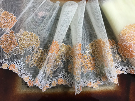 Shades of Orange and White on Yellow  Background- Embroidered Lace, 18 cm Wide.